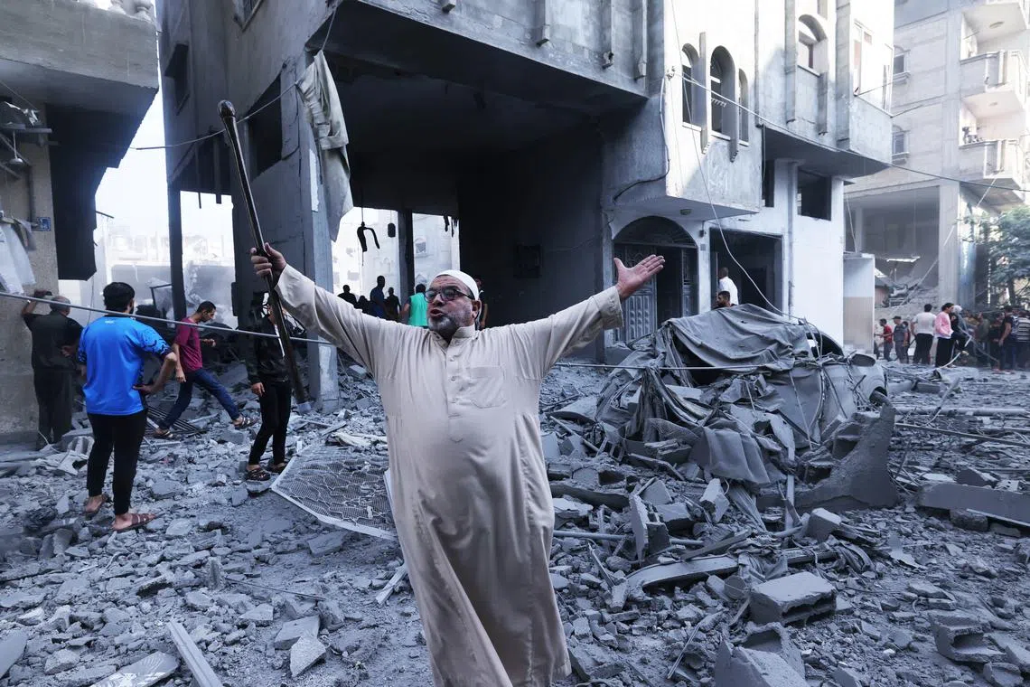 A Palestinian reacting amid the rubble of a building after an Israeli airstrike on the Rafah refugee camp, in the southern Gaza Strip on Oct 17. 