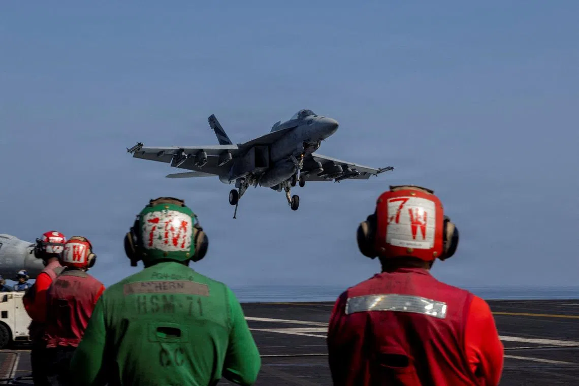 An F/A-18E Super Hornet prepares to make an arrested landing on the flight deck of the U.S. Navy Nimitz-class aircraft carrier USS Abraham Lincoln in support of the Operation Epic Fury attack on Iran from an undisclosed location March 2, 2026.  U.S. Navy/Handout via REUTERS