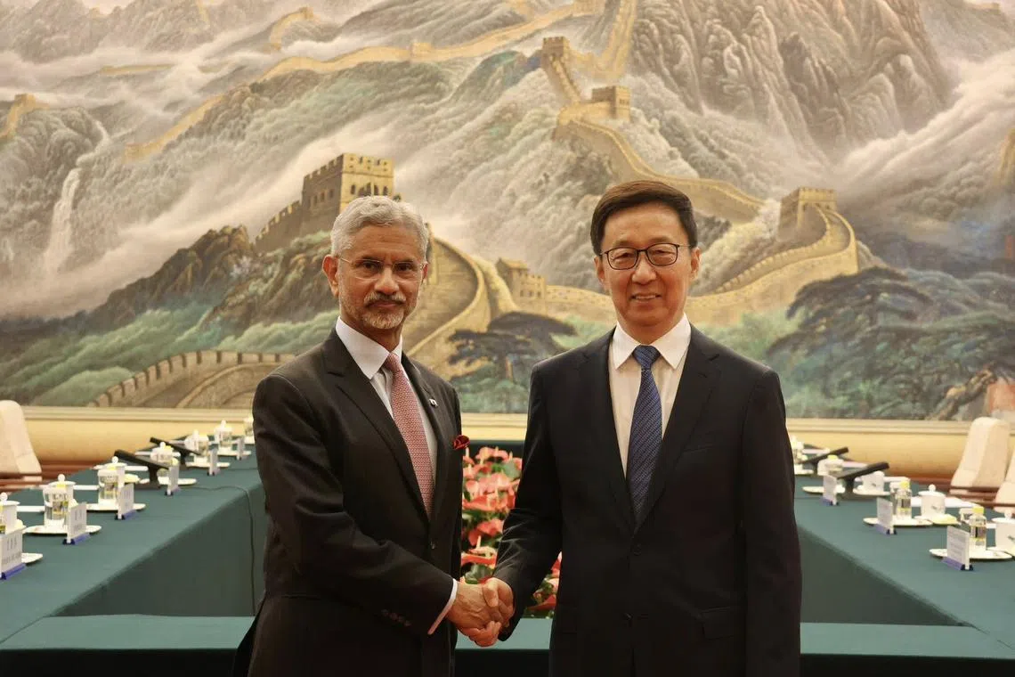 Indian External Affairs Minister S. Jaishankar poses with Chinese Vice-President Han Zheng in Beijing on July 14.