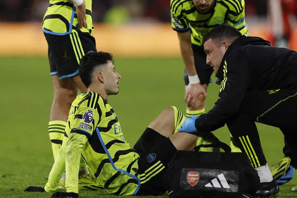 Soccer Football - Premier League - Sheffield United v Arsenal - Bramall Lane, Sheffield, Britain - March 4, 2024 Arsenal's Gabriel Martinelli receives medical attention after sustaining an injury Action Images via Reuters/Jason Cairnduff /File Photo