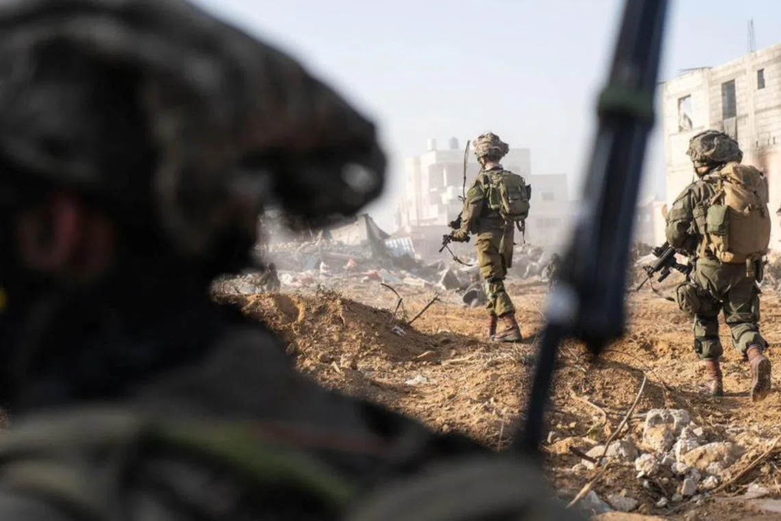 FILE PHOTO: Israeli soldiers operate in the Gaza Strip amid the ongoing conflict between Israel and the Palestinian Islamist group Hamas, in this handout picture released on January 29, 2024. Israel Defense Forces/Handout via REUTERS
