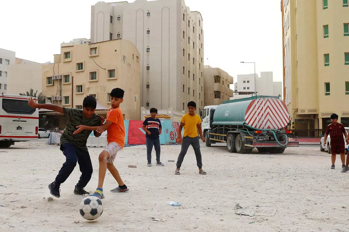 Children are seen playing football in Doha, Qatar, Dec 12, 2022, the host nation of the ongoing FIFA World Cup.