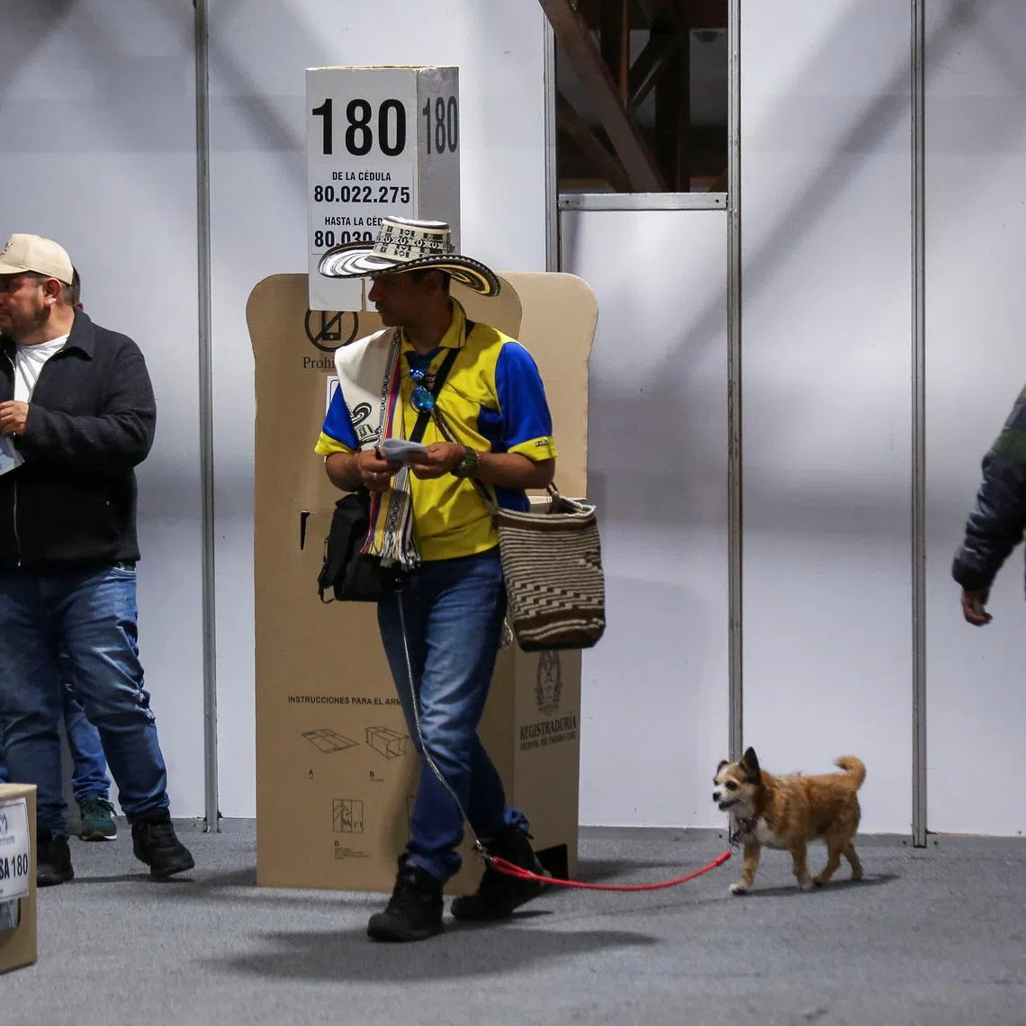 People vote at Colombia's largest polling station during a runoff between right-wing presidential candidate Abelardo De La Espriella and leftist candidate Ivan Cepeda, in Bogota, Colombia, on June 21.