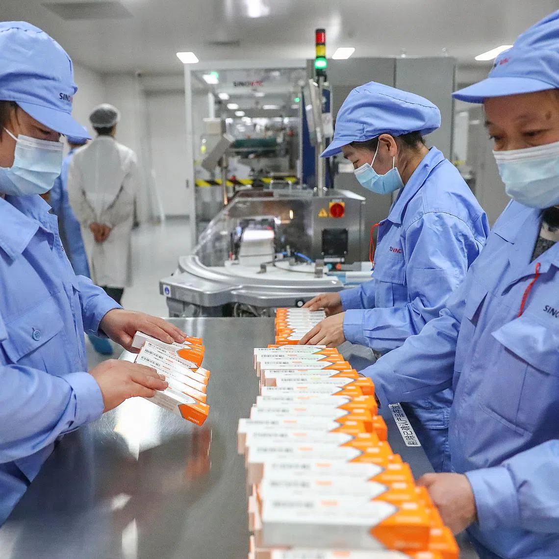 Workers working at a Sinovac Covid-19 vaccine production line in Beijing in 2021. So far, the biotech industry is relatively insulated from Mr Trump’s tariffs.