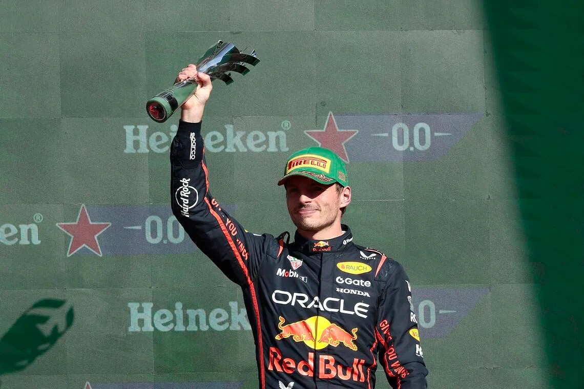 Red Bull's Max Verstappen celebrates after finishing third in the Mexican Grand Prix.