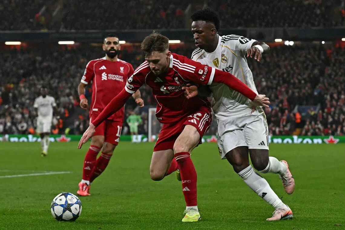 Liverpool's Conor Bradley was outstanding in his one-on-one duels with Real Madrid's Vinicius Junior (in white) during the Reds' 1-0 Champions League win at Anfield on Nov 4.