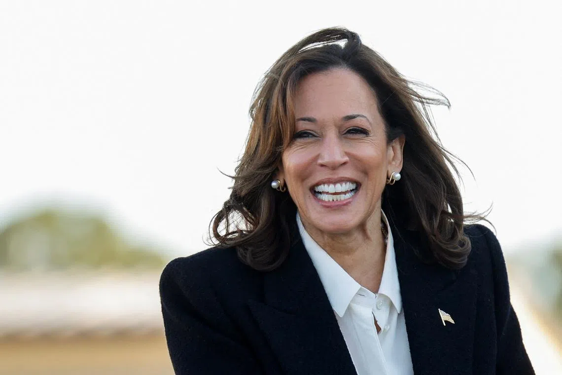 FILE PHOTO: Democratic presidential nominee U.S. Vice President Kamala Harris reacts upon departure at Pitt-Greenville Airport in Greenville, North Carolina, U.S., October 13, 2024. REUTERS/Jonathan Drak/File Photo