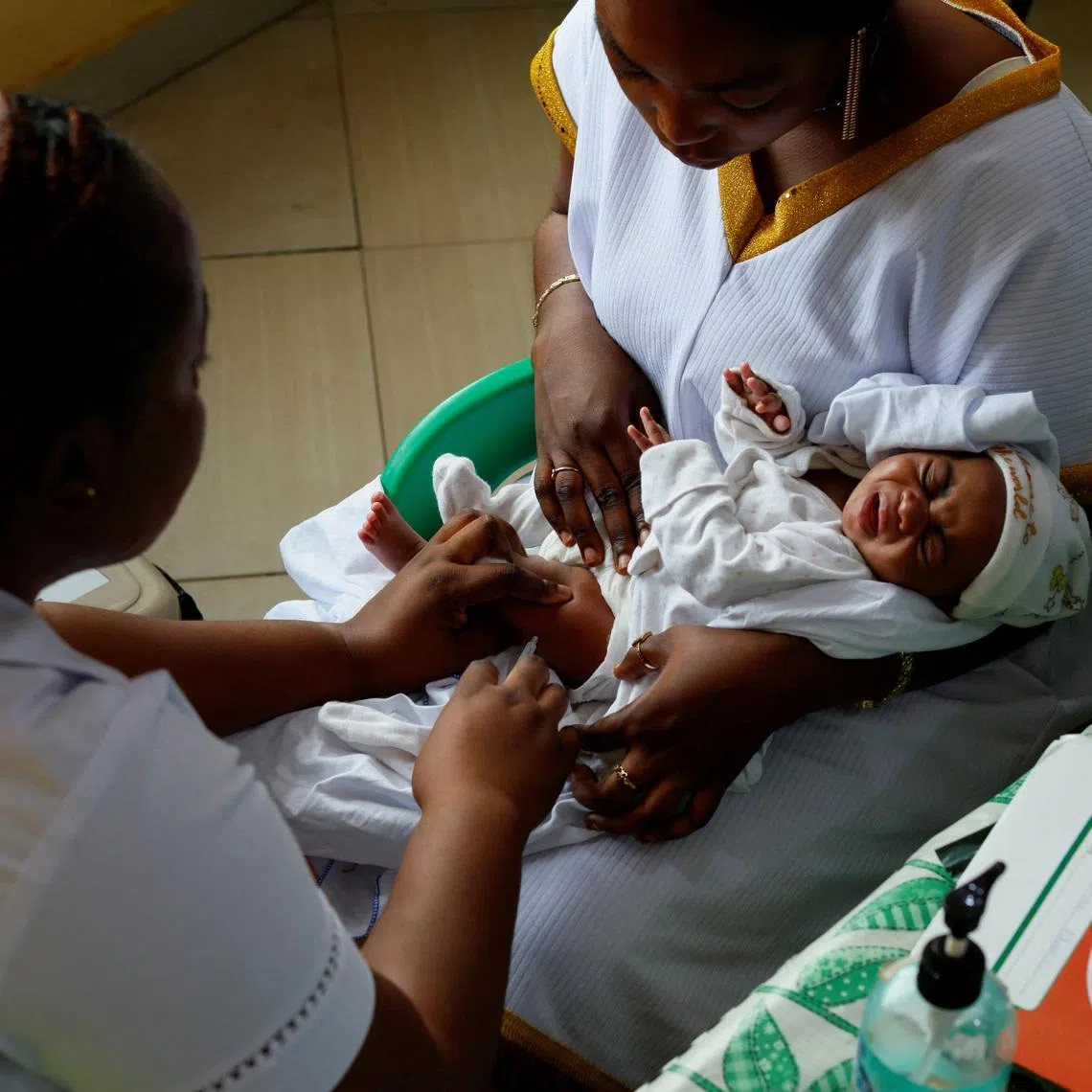 A health worker administers a dose of the RTS,S malaria vaccine, also known as Mosquirix, at the Mother and Child Hospital in Kasoa, Ghana, November 19, 2025. REUTERS/Francis Kokoroko