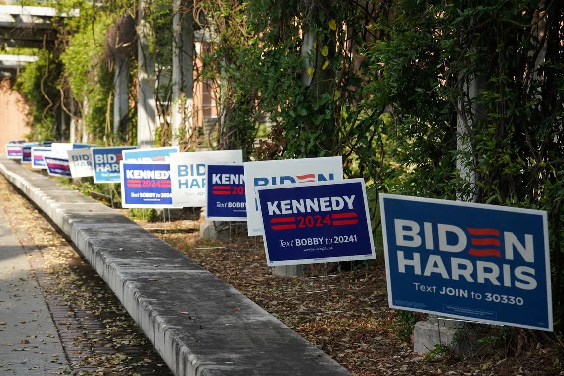 FILE PHOTO: A view of Biden-Harris and independent presidential candidate Robert F. Kennedy Jr. campaign signs ahead of the first 2024 presidential debate between Democratic presidential candidate U.S. President Joe Biden and Republican presidential candidate former U.S. President Donald Trump in Atlanta, Georgia, U.S., June 27, 2024.  REUTERS/Megan Varner/File Photo