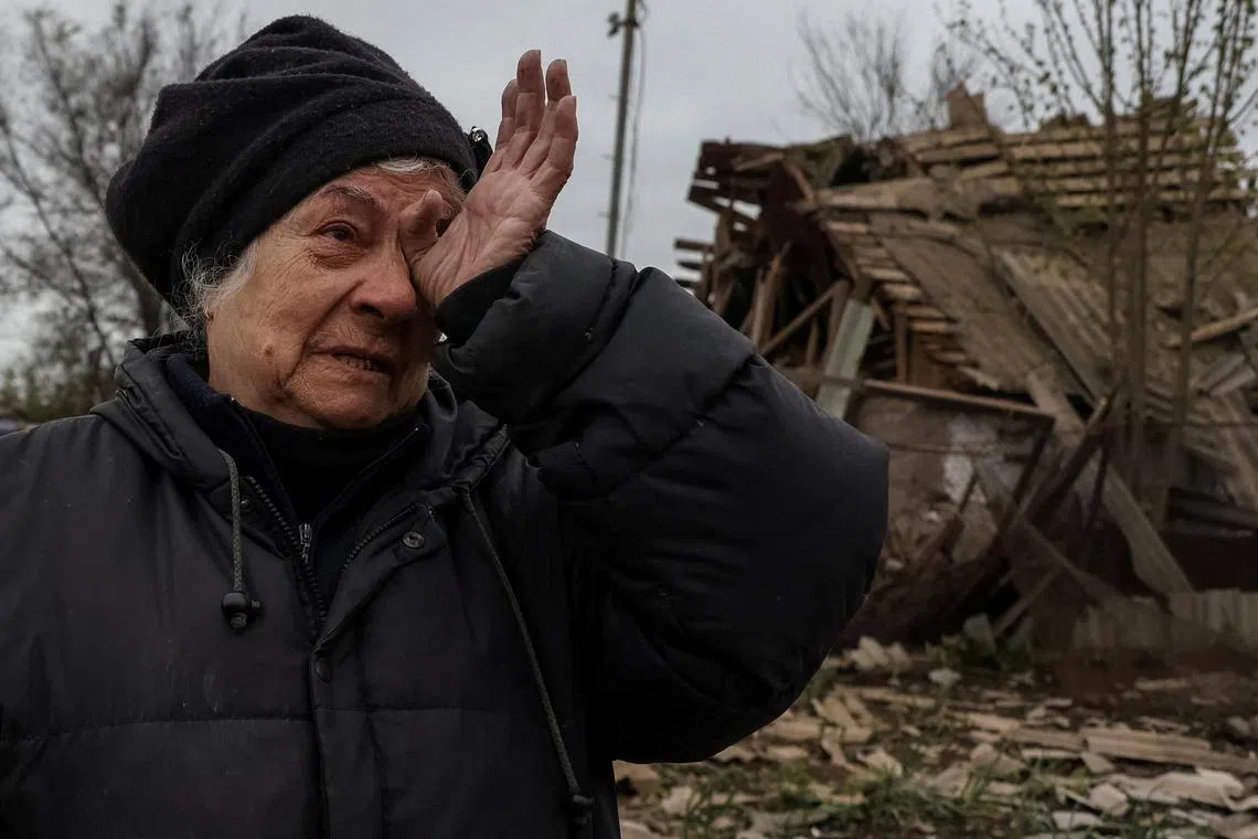 Liubov Vasylieva, 77, stands amid the ruins of her house, following a Russian military strike in the town of Pavlohrad, in Ukraine's Dnipropetrovsk region.    