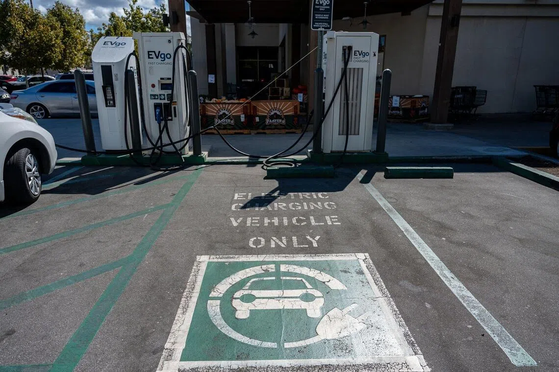 A parking space for electric vehicles (EV) near EVgo fast charging stations in Redwood City, California, US, on Tuesday, Sept. 30, 2025. EVgo Inc., one of America’s biggest charging companies, is open to buying its rivals as the end of a key federal subsidy adds further strain to the struggling industry, according to Chief Executive Officer Badar Khan. Photographer: David Paul Morris/Bloomberg