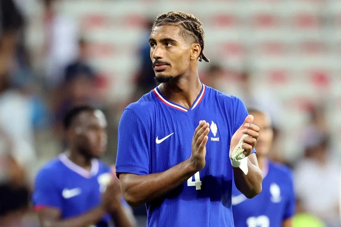 FILE PHOTO: Paris 2024 Olympics - Football - Men's Group A - France vs Guinea - Nice Stadium, Nice, France - July 27, 2024. Loic Bade of France applauds fans after the match. REUTERS/Raquel Cunha/File Photo