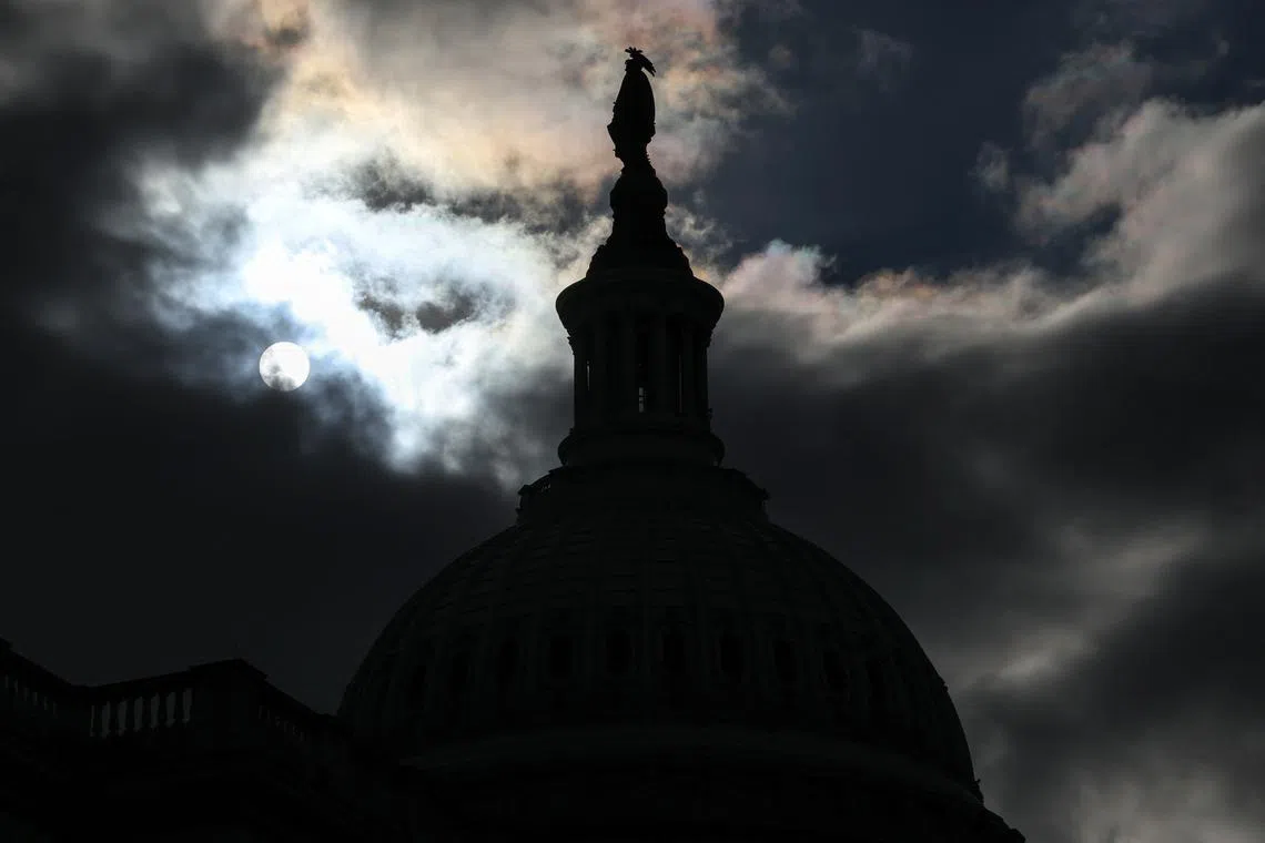 FILE PHOTO: The US Capitol dome is silhouetted against the sun in Washington, U.S., January 2, 2025. REUTERS/Evelyn Hockstein/File Photo