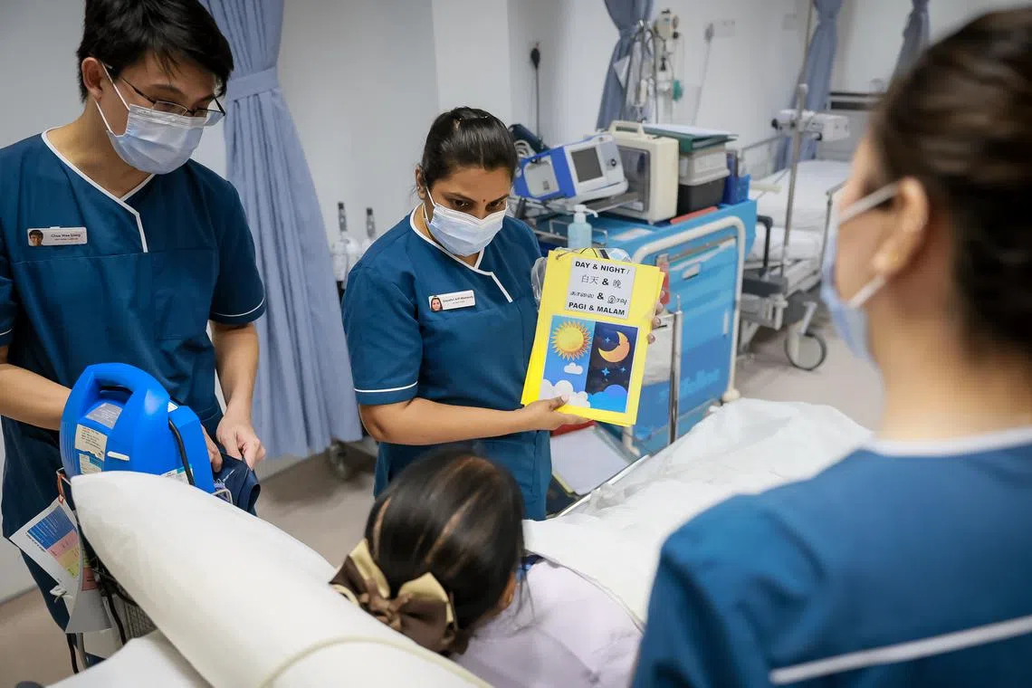 TTSH nurses demonstrating the use of a screening tool to detect and prevent delirium among older patients.