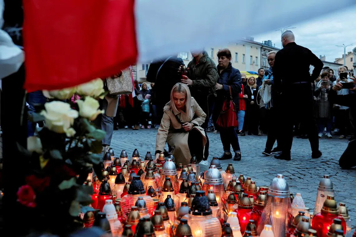 FILE PHOTO: Mourners gather to hold a vigil for the Polish aid worker Damian Sobol who was killed by the Israeli army in Gaza, among seven people working for the charity World Central Kitchen (WCK) who were killed in an Israeli airstrike, in Przemysl, Poland, April 4, 2024. Patryk Ogorzalek/ Agencja Wyborcza.pl via REUTERS/File Photo