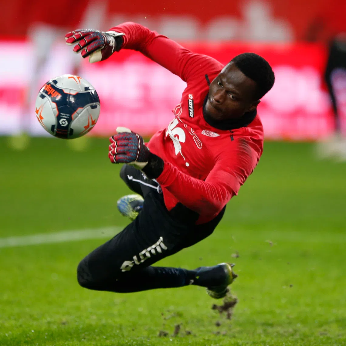 Soccer Football - Ligue 1 - Lille v Dijon - Stade Pierre-Mauroy, Lille, France - January 31, 2021 Dijon's Saturnin Allagbe  during the warm up before the match REUTERS/Pascal Rossignol