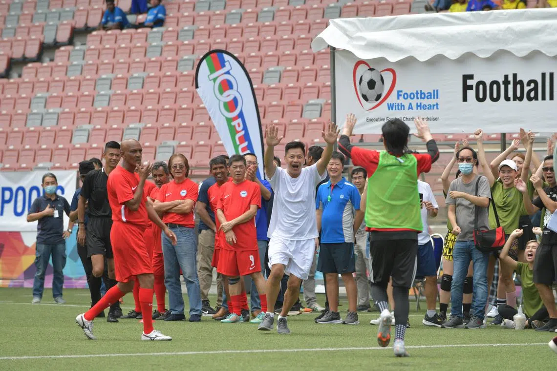 Local actor Li Nanxing (in white) at the Football With a Heart charity event on Saturday.