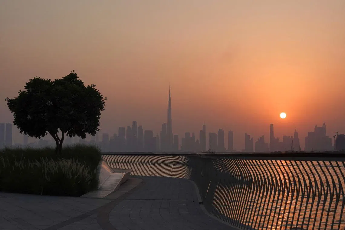 The Burj Khalifa building peaks through the skyline as the sun sets over Dubai, United Arab Emirates, September 9, 2023. REUTERS/Amr Alfiky/File Photo