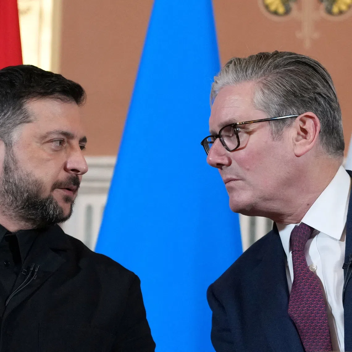 Ukraine's President Volodymyr Zelenskiy and Britain's Prime Minister Keir Starmer speak to the media after a Coalition of the Willing' meeting in London, Britain, October 24, 2025.   Kirsty Wigglesworth/Pool via REUTERS