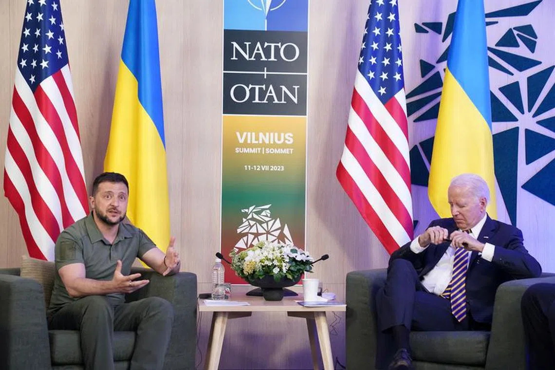 FILE PHOTO: Ukraine's President Volodymyr Zelenskiy and U.S. President Joe Biden attend a bilateral meeting, as the NATO summit is held in Vilnius, Lithuania, July 12, 2023. REUTERS/Kevin Lamarque