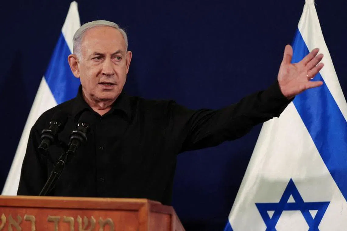 Israeli Prime Minister Benjamin Netanyahu holds a press conference with Defense Minister Yoav Gallant and Cabinet Minister Benny Gantz (not pictured) in the Kirya military base in Tel Aviv , Israel , 28 October  2023.    ABIR SULTAN POOL/Pool via REUTERS