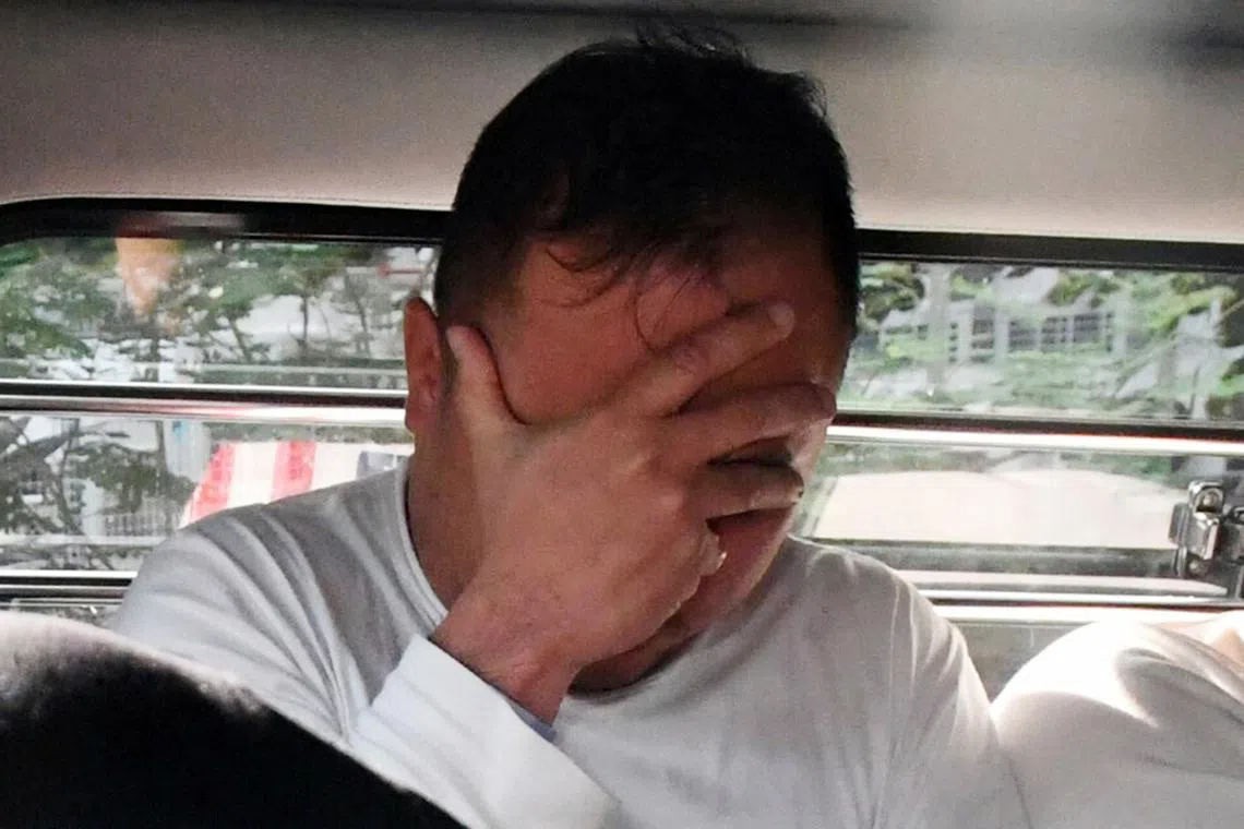 Tiah Kok Hwee being brought to court in 2018. He pleaded guilty on Tuesday to 20 counts of criminal breach of trust.