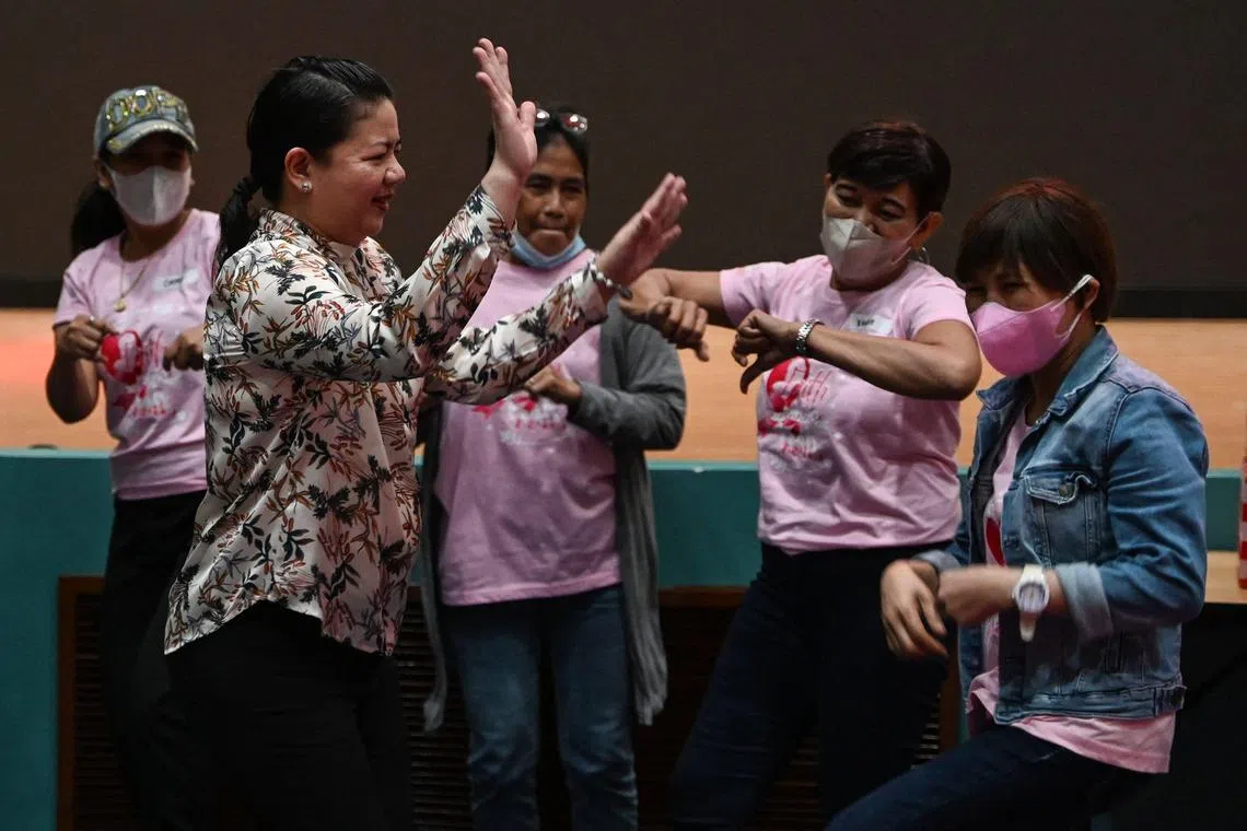 Dr Katherine Hernandez (left) dances with her patients during Christmas party for cancer patients at a hospital in Quezon City, Metro Manila.