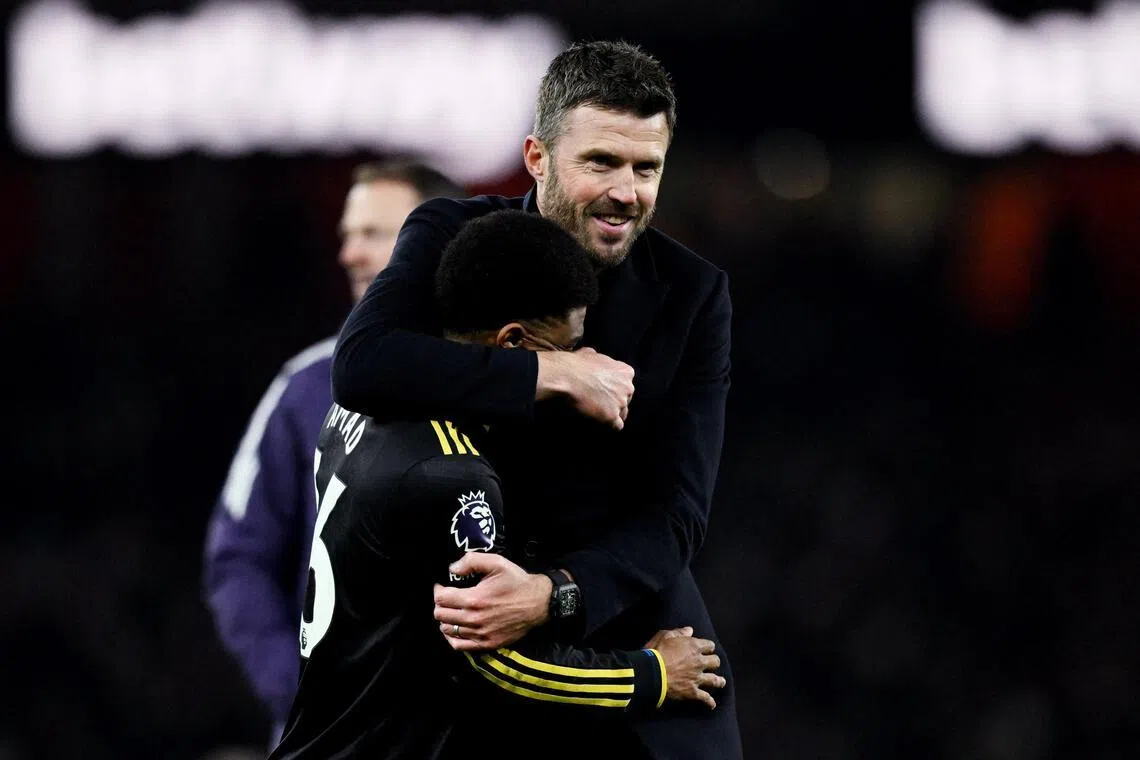 Manchester United interim manager Michael Carrick celebrating with forward Amad Diallo after their 3-2 win over Arsenal on Jan 25.