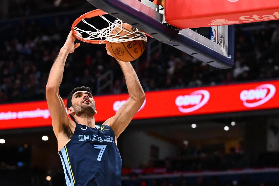 Memphis Grizzlies forward Santi Aldama dunks the ball against the Washington Wizards during the first half at Capital One Arena. 