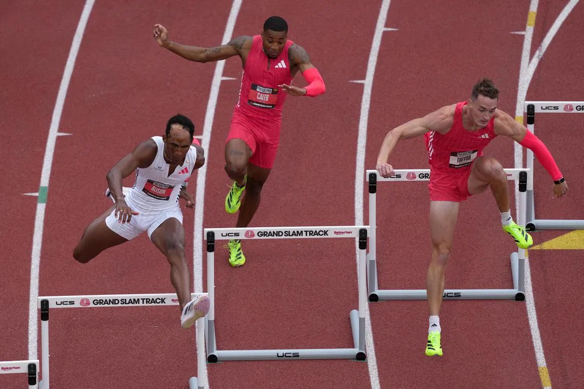 FILE PHOTO: May 31, 2025; Philadelphia, PA, USA; Alison Dos Santos (BRA), left, Caleb Dean (USA), center, and Trevor Bassitt (USA) run in the 400m hurdles during the Grand Slam Track Philadelphia at Franklin Field. Mandatory Credit: Kirby Lee-Imagn Images/File Photo