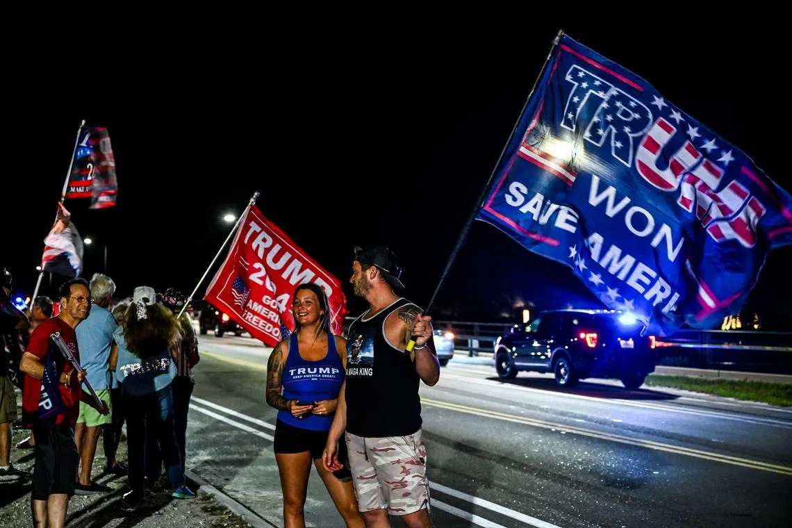 Supporters of former US President Donald Trump protest near the Mar-a-Lago Club in Palm Beach, Florida, on March 30, 2023.