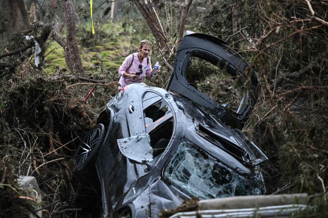 A volunteer looking for missing people in Hunt, Texas, on July 6, following severe flash flooding on the July 4 holiday.
