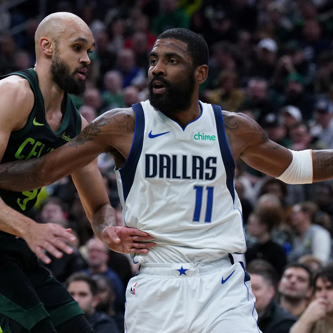 FILE PHOTO: Feb 6, 2025; Boston, Massachusetts, USA; Dallas Mavericks guard Kyrie Irving (11) drives the ball against Boston Celtics guard Derrick White (9) in the first quarter at TD Garden. Mandatory Credit: David Butler II-Imagn Images/File Photo