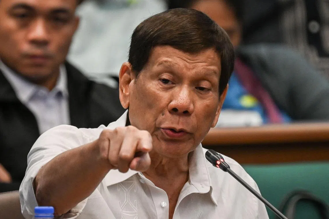 Former Philippine president Rodrigo Duterte gestures as he attends a Senate probe on the drug war during his administration, in Manila on October 28, 2024. 