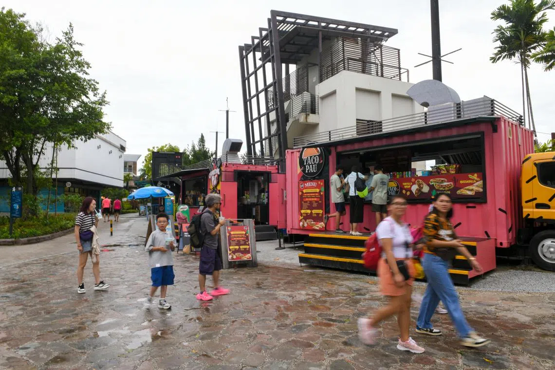 Patrons at the International Food Street in Sentosa on June 30.