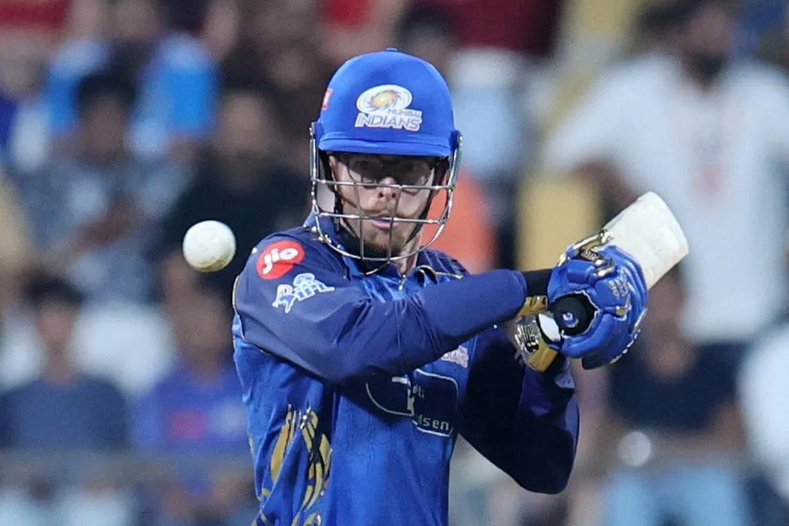 Cricket - Indian Premier League - IPL - Mumbai Indians v Royal Challengers Bengaluru - Wankhede Stadium, Mumbai, India - April 12, 2026 Mumbai Indians' Mitchell Santner in action REUTERS/Francis Mascarenhas