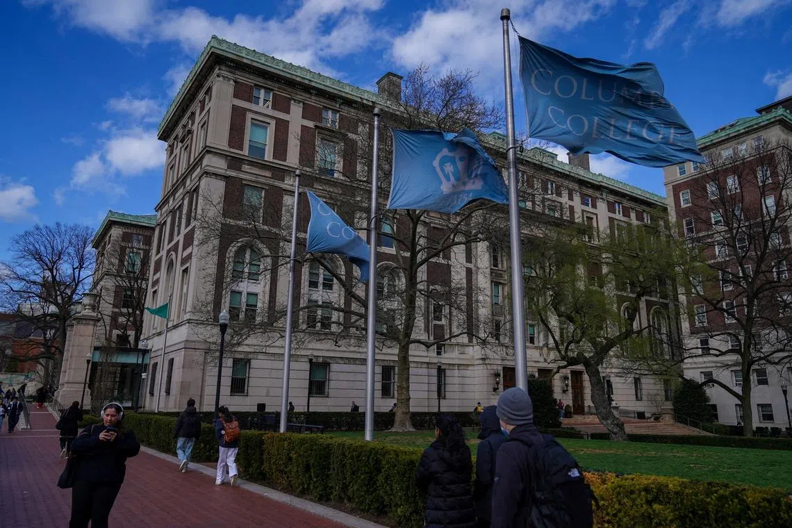 FILE PHOTO: People walk on campus at Columbia University in New York City, U.S., April 8, 2025. REUTERS/Ryan Murphy/File Photo