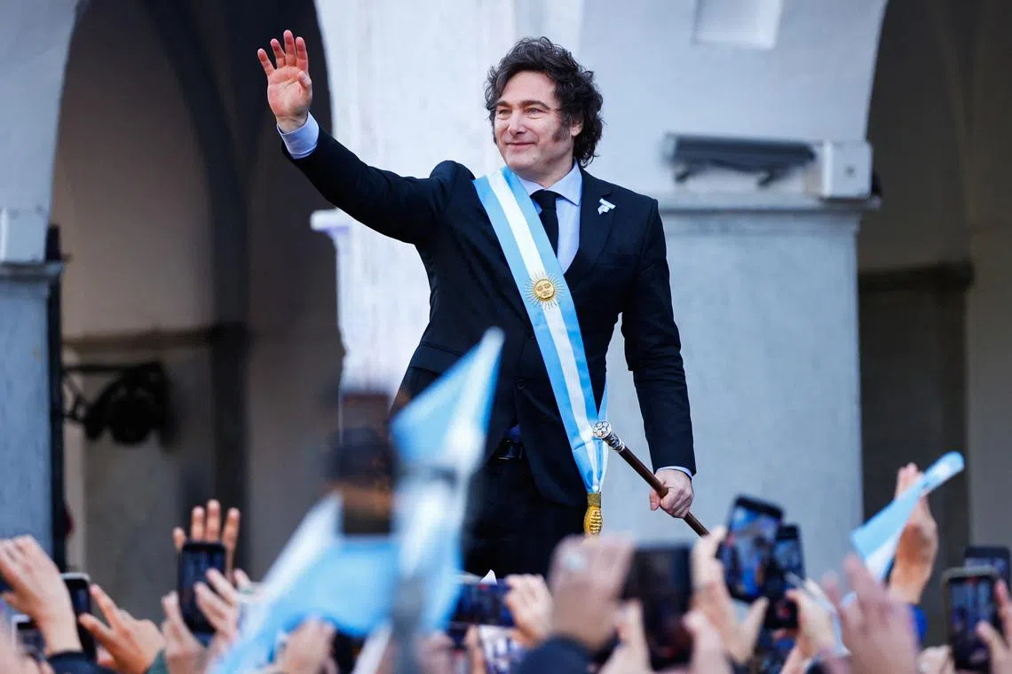 Argentina's President Javier Milei waves to supporters outside the Cabildo during the commemoration of the 214th anniversary of the May Revolution, in Cordoba, Argentina May 25, 2024. REUTERS/Leandro Bustamante Gomez