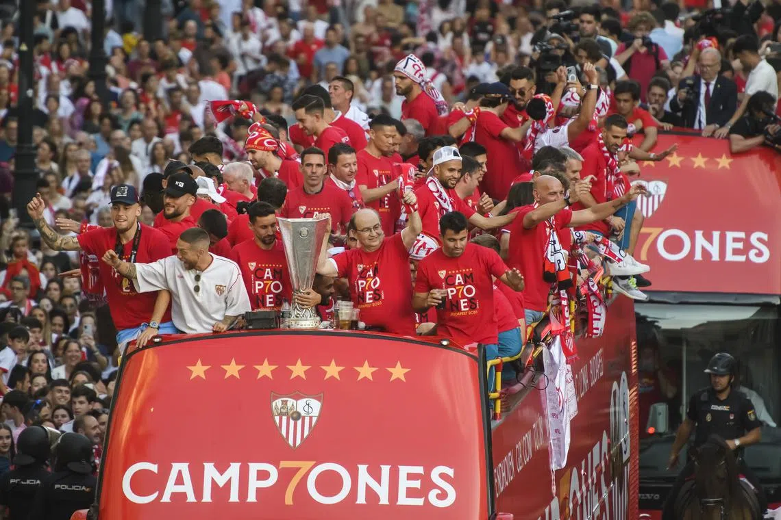 Sevilla's players take part in a parade to celebrate their victory in the UEFA Europa League final, in Seville, Spain, on June 1, 2023. Sevilla won the final 4-1 on penalties. 
