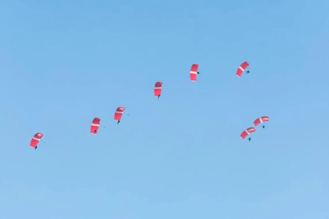 The Red Lions beginning their free fall descent towards the Padang on Augn 9, 2023. ST PHOTO: GAVIN FOO