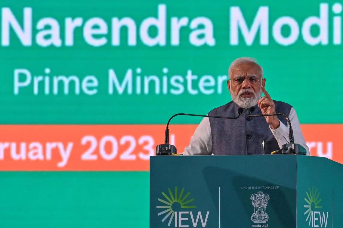 India's PM Narendra Modi said rising geo-political tensions had led to unsustainable debt levels in several countries.