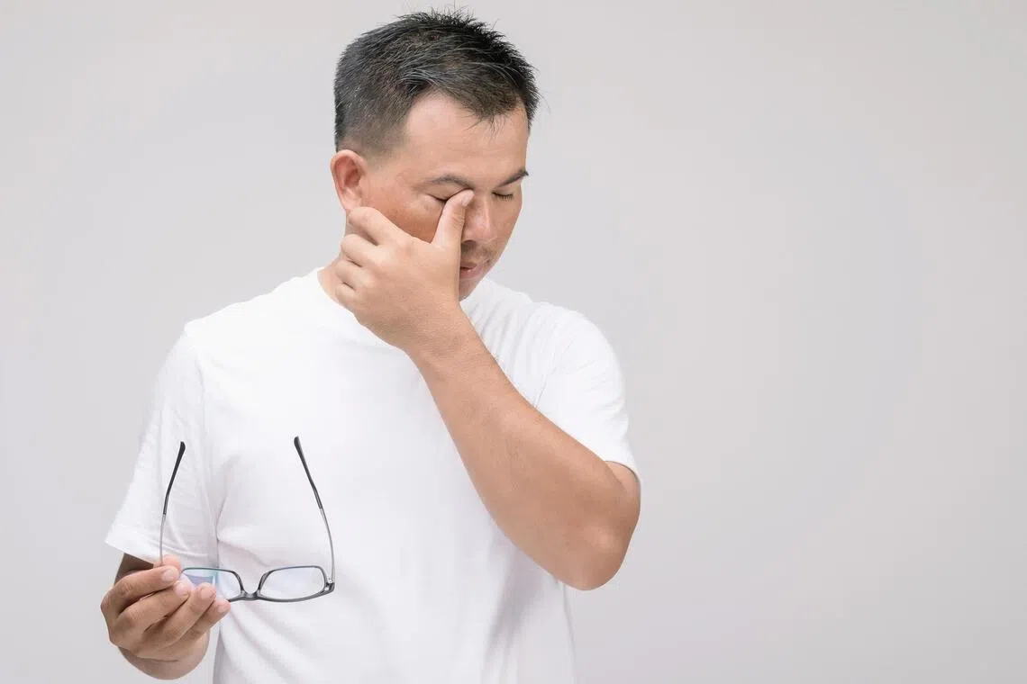 anglaucoma - Eye irritation concept : Portrait of Asian man in posture of eye tired,  irritation or problem about his eye. Studio shot isolated on grey background

CREDIT: ADOBE STOCK