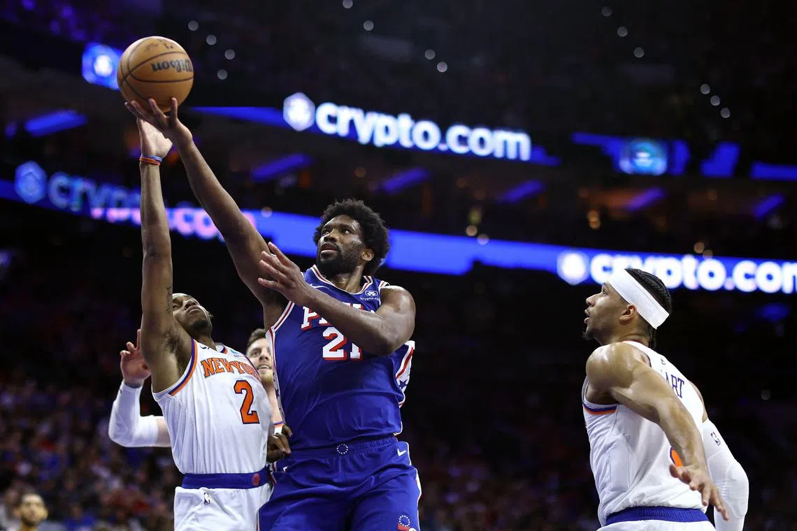 Joel Embiid of the Philadelphia 76ers shoots a lay-up past Miles McBride of the New York Knicks during the third quarter of Game 3 of the Eastern Conference first-round play-offs.