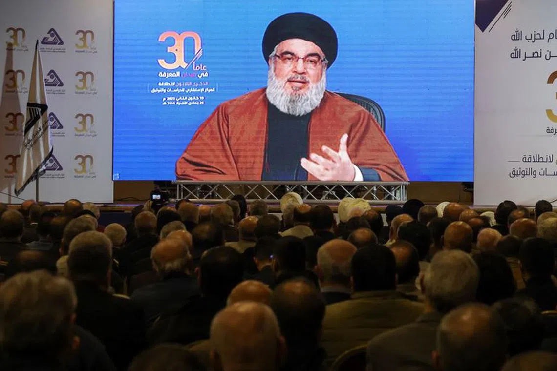 Lebanon's Hezbollah leader Sayyed Hassan Nasrallah gestures as he addresses his supporters through a screen in Beirut's southern suburbs, in Beirut, Lebanon January 19, 2023. REUTERS/Mohamed Azakir/File Photo