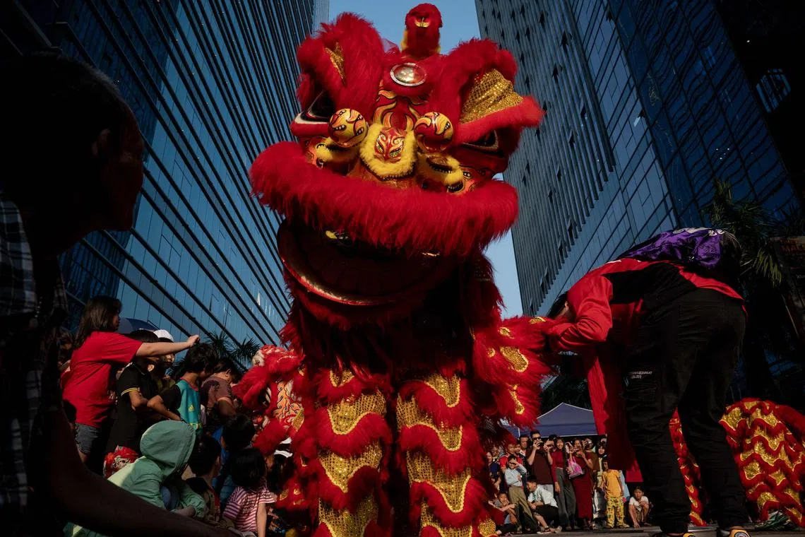 A lion dance team performing on a street in Yangon on Feb 10, 2024, on the first day of the Lunar New Year of the Dragon. 
