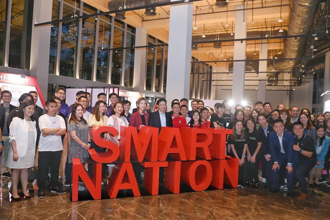 Prime Minister Lawrence Wong (centre, in suit) launched the Smart Nation 2.0 strategy on Oct 1.