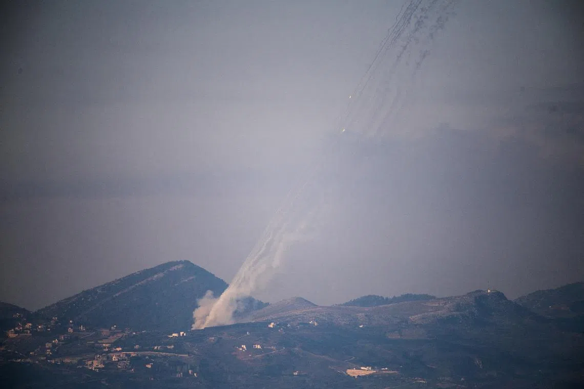 FILE PHOTO: Rockets being launched from Lebanon towards Israel as seen from the Israeli side of the border with Lebanon, following an escalation between Hezbollah and Israel amid the U.S.-Israeli conflict with Iran,  March 3, 2026. REUTERS/Gil Eliyahu/File Photo
