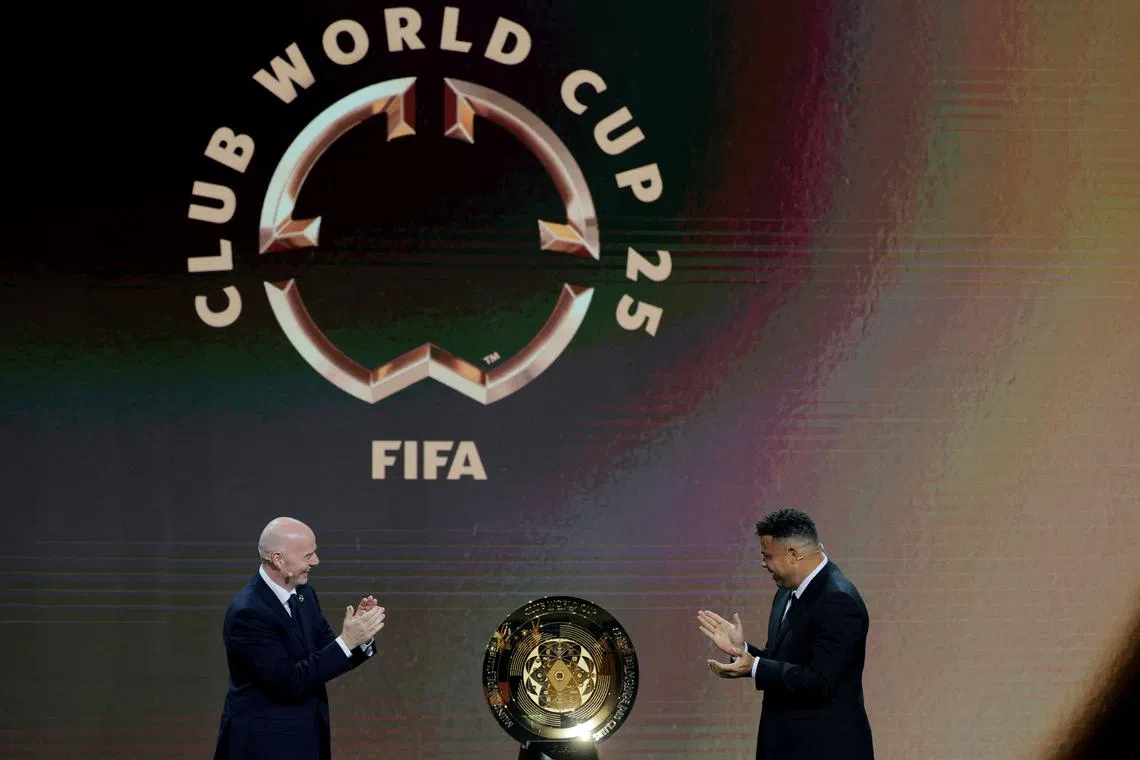 FILE PHOTO: Soccer Football - Club World Cup - Draw - Miami, Florida, United States - December 5, 2024 FIFA president Gianni Infantino and Ronaldo unveil the trophy before the draw REUTERS/Brian Snyder/File Photo