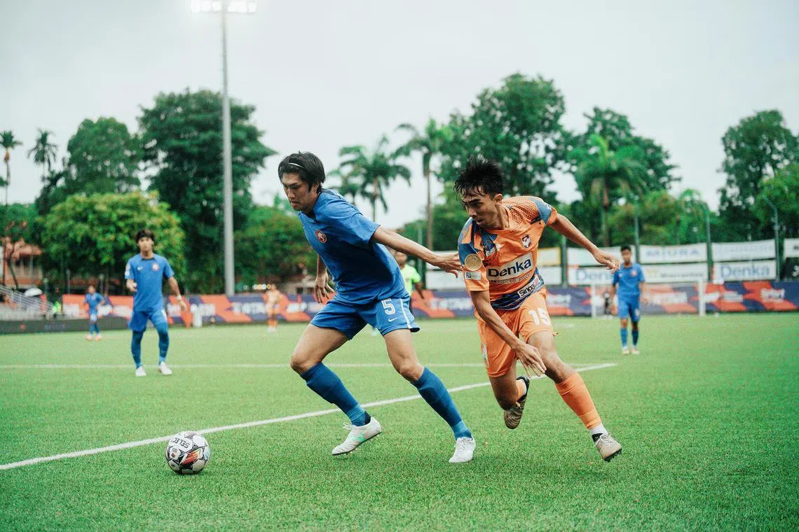 Young Lions’ Jun Kobayashi (left) fending off Albirex Niigata’s Syed Firdaus Hassan during a 0-0 draw between the two sides at the Jurong East Stadium on April 13. 