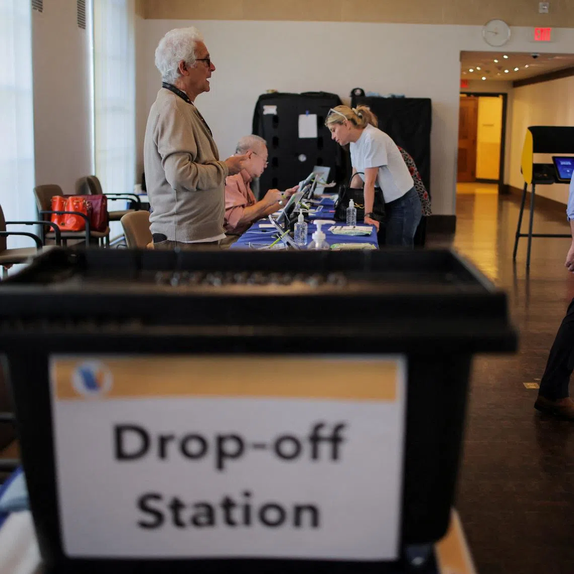 Matthew Kessler heads to a voting machine to vote on Proposition 50 at the Beverly Hills City Hall voting center in Beverly Hills, California, U.S., October 30, 2025.